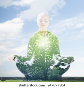 Sport, Fitness, Yoga, Double Exposure And People Concept - Happy Young Woman Meditating In Lotus Pose Over Blue Sky And Green Tree Background