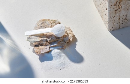 Sport food supplement powder with natural beige background and props. Supplement, creatine, hmb, bcaa, amino acid or vitamine in a white scoop. Sport nutrition concept... Check my profile for more! - Shutterstock ID 2173381033