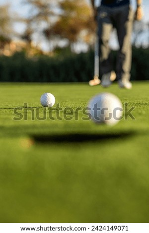 The sport of golf and the elements used in its practice, irons, tee and flagstick.