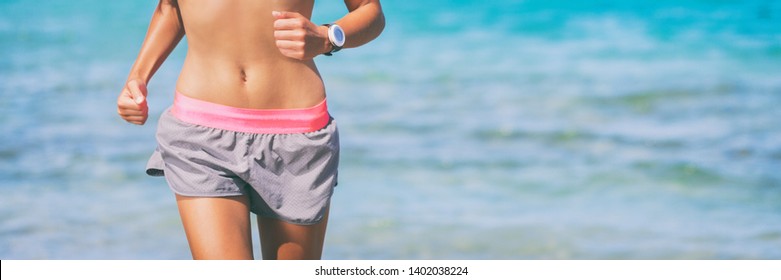 Sport Health And Fitness Banner Of Woman Athlete Running On Beach Ocean Blue Background. Fit Girl Wearing Smartwatch Wearable Tech And Summer Shorts.