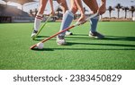 Sport, hockey and athlete legs on field playing game and fitness people workout, competition and exercise outdoor. Sports match, hockey player competitive and active life with training at stadium.