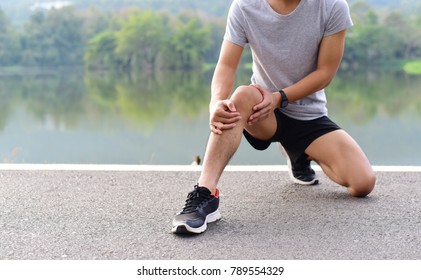 Sport Injury, A Man Has Knee Pain During Outdoor Exercise