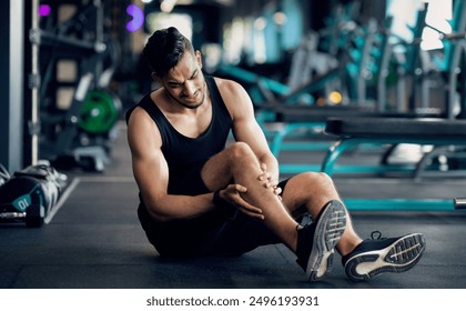 Sport Injury. Upset Arab Male Athlete Suffering From Knee Trauma While Training At Gym, Middle Eastern Man Sitting On Floor And Massaging Aching Area, Sporty Guy Frowning With Pain, Copy Space - Powered by Shutterstock