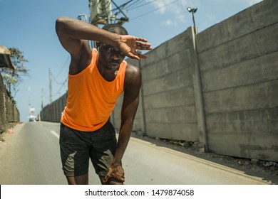 Sport Lifestyle Portrait Of Tired And Exhausted Black Badass Looking African American Man Breathing Cooling Off After Hard Running Workout In Fitness Sacrifice And Athlete Training Commitment