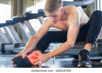 Sport Man Injured Ankle Twist Sprain Accident In Sport Exercise Running Jogging On Treadmill Equipment. 