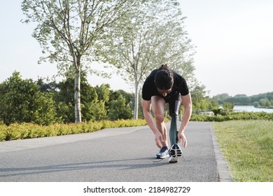 Sport man with physical disability getting ready for training routine outdoor - Focus on prosthetic leg - Powered by Shutterstock