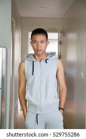 Sport Man In Sleeveless Hoodie Going To The Gym