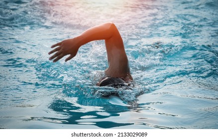 Sport Man Swimmer Triathlon Fitness Athlete Training Swimming In Wave Pool At Gym Health Centre. Swimmer Man Swmming In Blue Water Banner Panorama. Sport And Fitness Cardio Exercise.