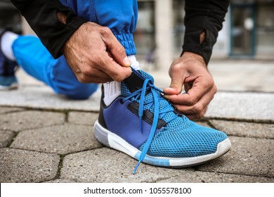 Sport Man Tying Sneakers. Close Up. 