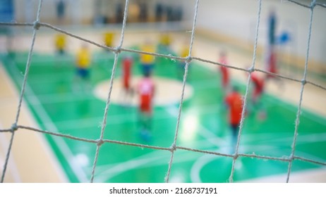 Sport Mesh On Blurred Background Of Volleyball Game, Indoor. Teamwork Concept, Selective Focus.