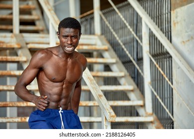 Sport Motivation. Black Male Athlete Running Up On Urban Stairs Outdoors, Enjoying Morning Workout, With Free Space