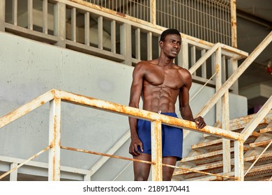 Sport Motivation. Black Male Athlete Running Up On Urban Stairs Outdoors, Enjoying Morning Workout, With Free Space