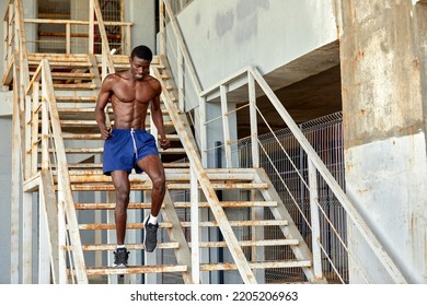 Sport Motivation. Black Male Athlete Running Up On Urban Stairs Outdoors, Enjoying Morning Workout, With Free Space