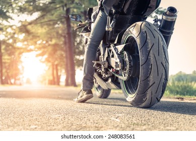 sport motorbike on the side of the road. Biker ready to run