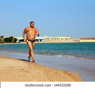 Sport - Overweight Man Running On Sea Coastline