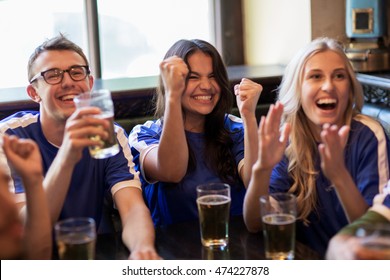 Sport, People, Leisure, Friendship And Entertainment Concept - Happy Football Fans Or Friends With Beer Watching Game And Celebrating Victory At Bar Or Pub