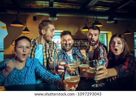 Similar – Image, Stock Photo Young business people on the roof terrace at the Afterwork Beer