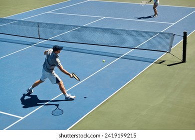 Sport, people and tennis on court with game, competition and performance outdoor with fitness and energy. Athlete, player and ball on turf for training, exercise and racket with fun, action and hobby - Powered by Shutterstock