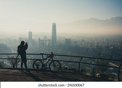 Sport photographer at the top of the hill. Santiago de Chile cityscape. - Powered by Shutterstock