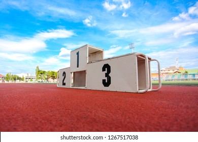 Sport Podium On Run Track Under The Blue Sky