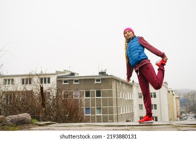 Sport And Recreation. Fit Slim Sporty Teen Girl Stretching Warming Up Outdoor On City Street. Woman Exercising On Fresh Air.