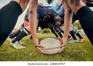 Sport, rugby ball and team on field, men playing game with energy and fitness with huddle together. Teamwork, scrum and ready for professional match, male sports club and outdoor with exercise - Powered by Shutterstock