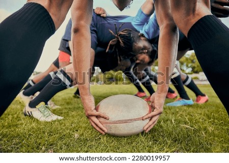 Sport, rugby ball and team on field, men playing game with energy and fitness with huddle together. Teamwork, scrum and ready for professional match, male sports club and outdoor with exercise