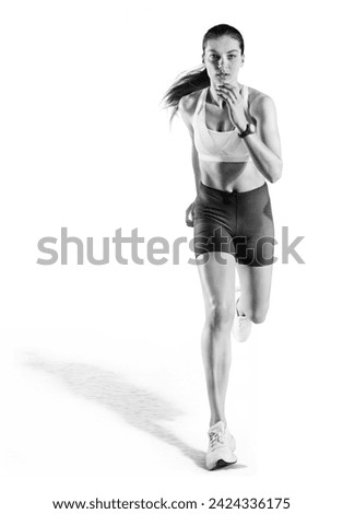 Sport. Run. Sporty woman running toward camera. Isolated on white.