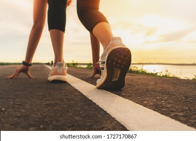 Sport Runner Feet Running On Sunset Lake Closeup On Shoe