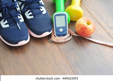 Sport Shoe With Glucose Meter,fruits And Dumbbells For Using In Fitness, Concept Of Diabetes, Exercise In Diabetes Patients Concept.