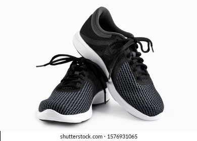 Sport shoes isolated on white background. Black sneakers running shoes. Casual shoes. Youth style. Shoes for fitness, running, yoga. - Powered by Shutterstock