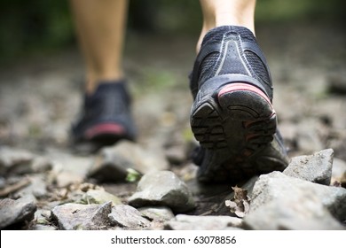 Sport shoes on trail walking in mountains, outdoors activity - Powered by Shutterstock