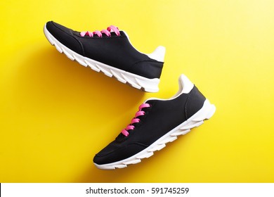 Sport Shoes And Yellow Background