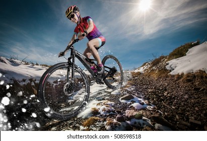 Sport. Snow Mountain Bike Cyclist Riding Single Track.