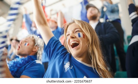 Sport Stadium Big Event: Portrait of Beautiful Sports Fan Girl with French Flag Painted Face Cheering For Her Team to Win. Crowd of Fans Shout, Celebrate Scoring a Goal, Championship Victory - Powered by Shutterstock