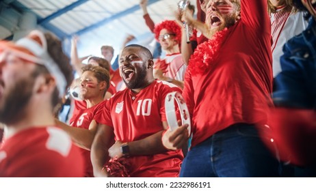 Sport Stadium Soccer Match: Diverse Crowd of Fans Cheer for their Red Team to Win. People Celebrate Scoring a Goal, Championship Victory. Group People with Painted Faces Cheer, Shout, Have Fun - Shutterstock ID 2232986191