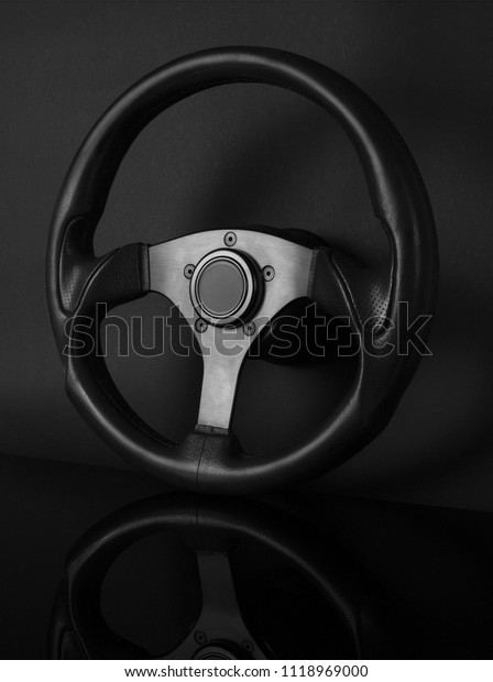Sport steering wheel\
isolated on black