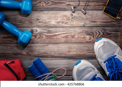 Sport Stuff On Wooden Table, Top View