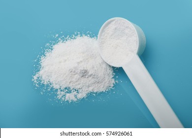 Sport supplement, creatine, hmb, bcaa, amino acid or vitamin mesure with powder. Sport nutrition concept. - Shutterstock ID 574926061