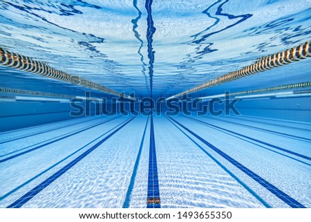 Sport Swimming pool underwater background.