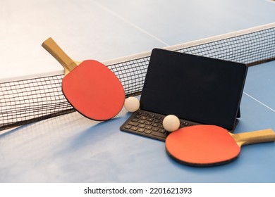 Sport, Technology, Game And Objects Concept - Close Up Of Ping-pong Or Table Tennis Rackets With Ball And Tablet Pc Computer