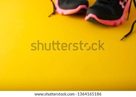 Sport template, active wear shoes sneackers, gym wear, over yellow, feminine background with copy space