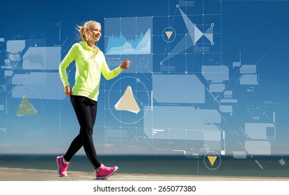 Sport, Training, Technology And Lifestyle Concept - Smiling Young Woman Walking Outdoors