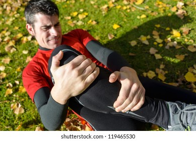 Sport Training Tibia Fracture Injury. Male Athlete Grabbing Painful Leg.