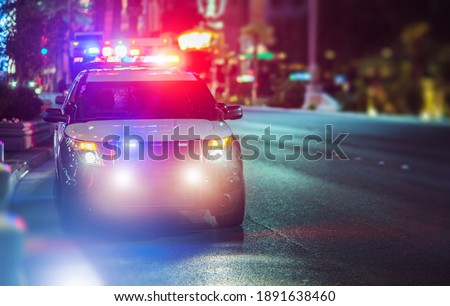 Sport Utility Vehicle Police Cruiser Emergency Assistance on the City Street. Police Car with Flashing Lights.