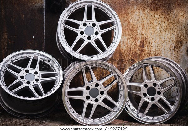 Sport wheels on the\
old metal background