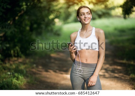 Similar – Attractive sporty woman with her cell phone