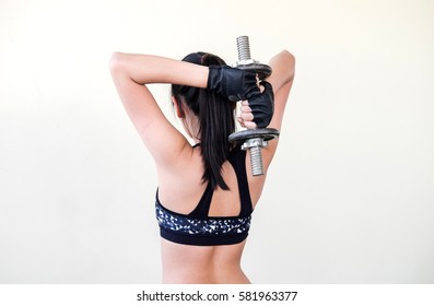 Sport. Woman sport body strong and beautiful dumbbell sport