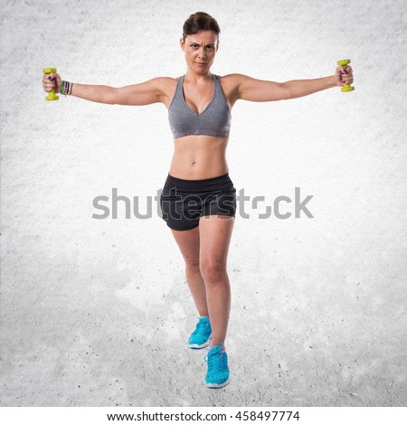 Similar – Image, Stock Photo One young athletic woman at crossfit training, exercising with trx suspension fitness straps over dark background, front view, looking at camera