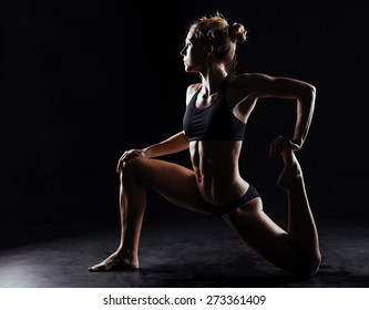 Sport Woman Doing Yoga On Black Background